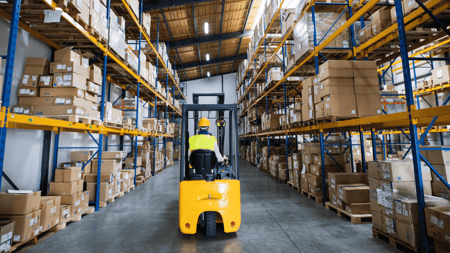 employee operating a forklift in a warehouse