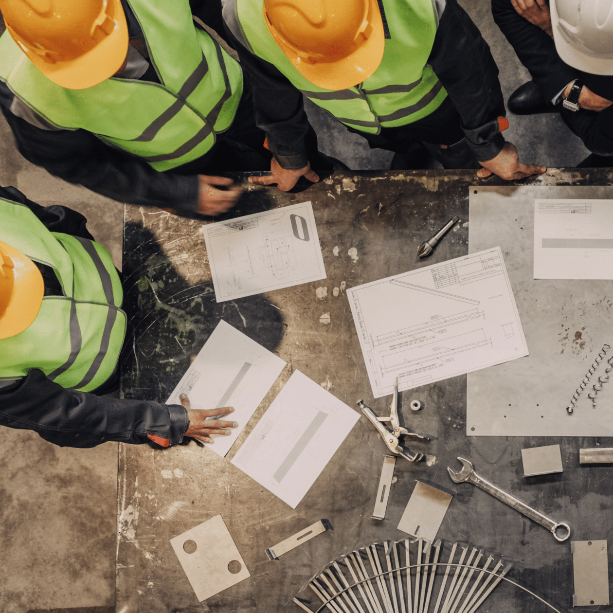 employees reviewing paperwork on jobsite-1